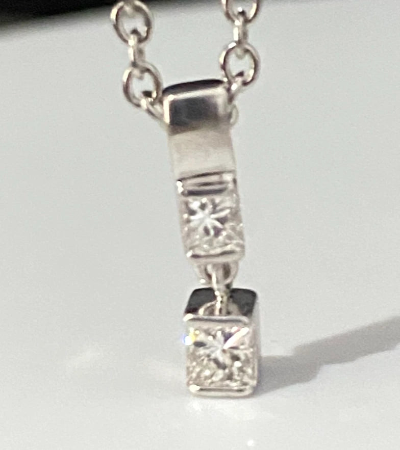 A 950 Platinum & 0.25CT Diamond Two Stone Pendant