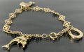 9K Yellow Gold Flower Link Horseshoe Dolphin Charm Bracelet 17.0cm Long