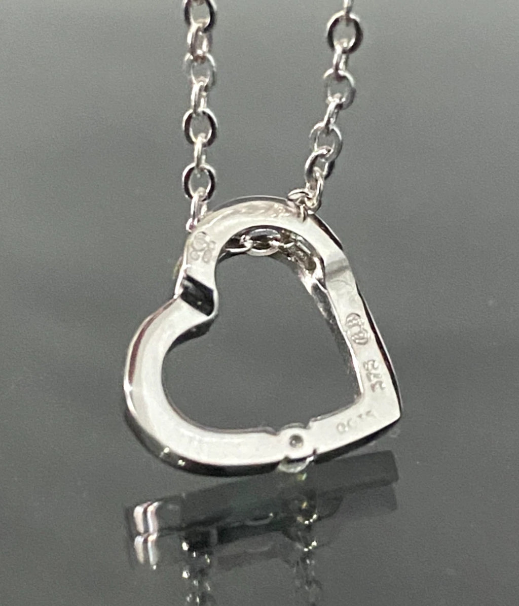 9K White Gold & Diamond Tension Set Heart Pendant