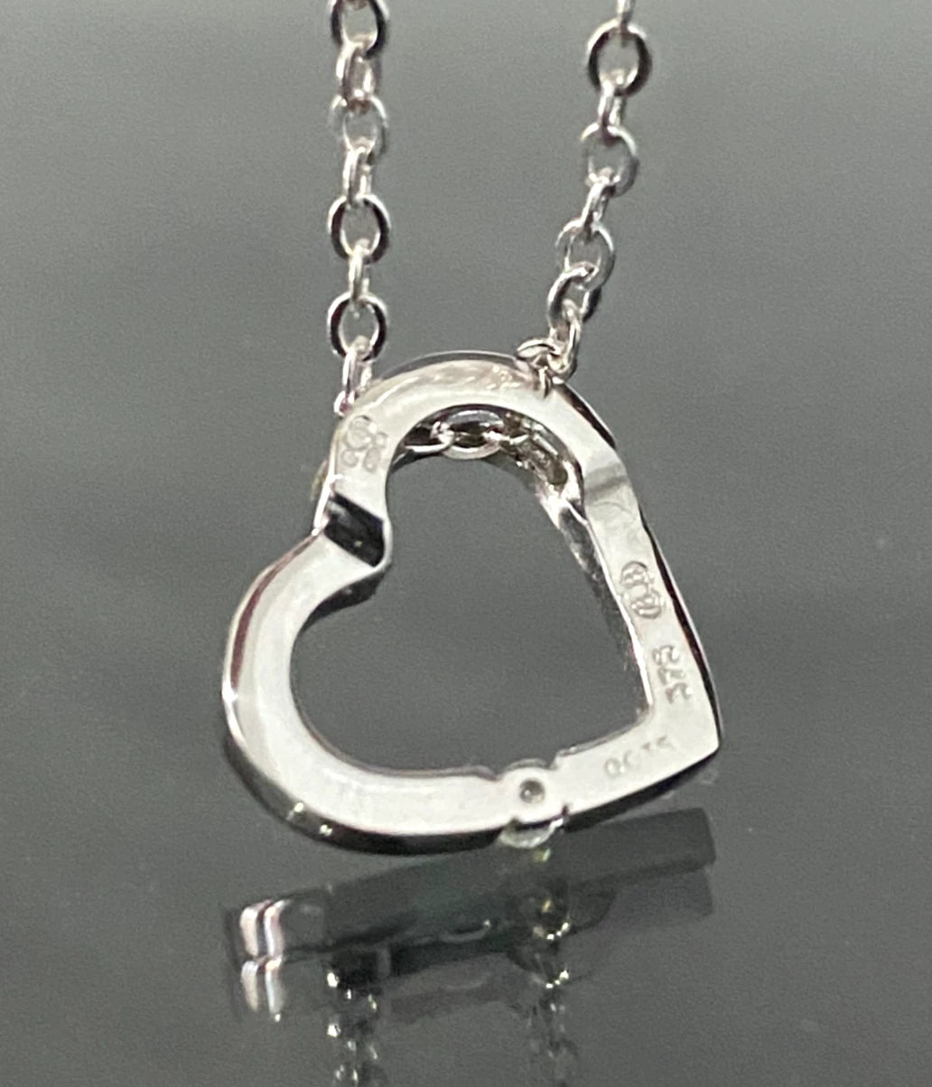 9K White Gold & Diamond Tension Set Heart Pendant