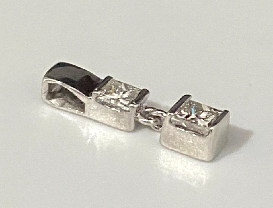 A 950 Platinum & 0.25CT Diamond Two Stone Pendant
