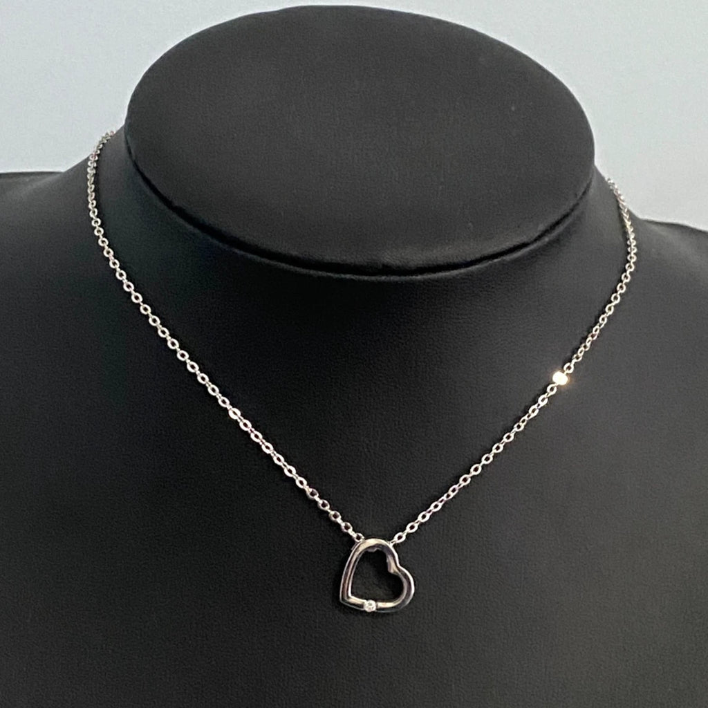 9K White Gold & Diamond Tension Set Heart Pendant