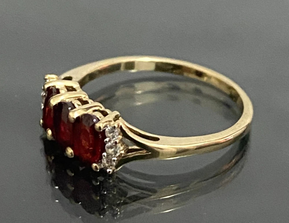 9ct Yellow Gold with 0.93CT Ruby Three Stone Ring Size K 1/2 (US 5.5)