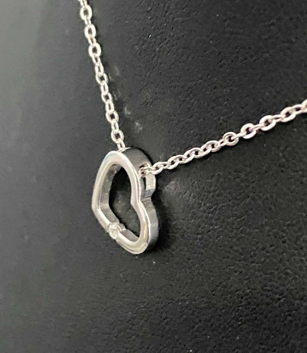9K White Gold & Diamond Tension Set Heart Pendant