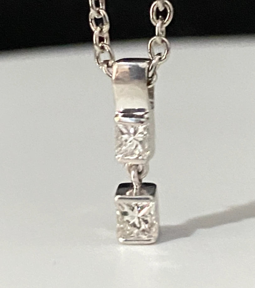 A 950 Platinum & 0.25CT Diamond Two Stone Pendant