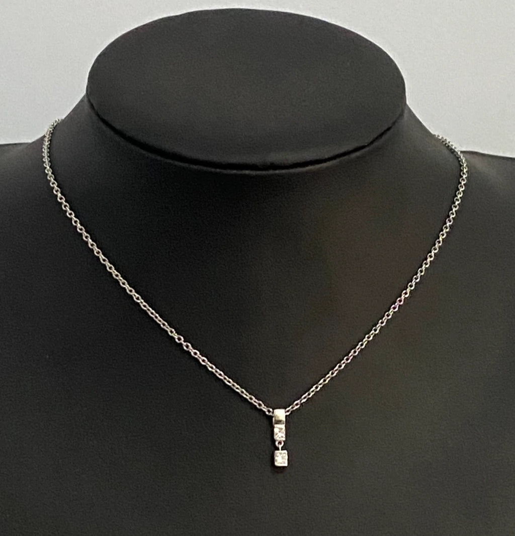 A 950 Platinum & 0.25CT Diamond Two Stone Pendant