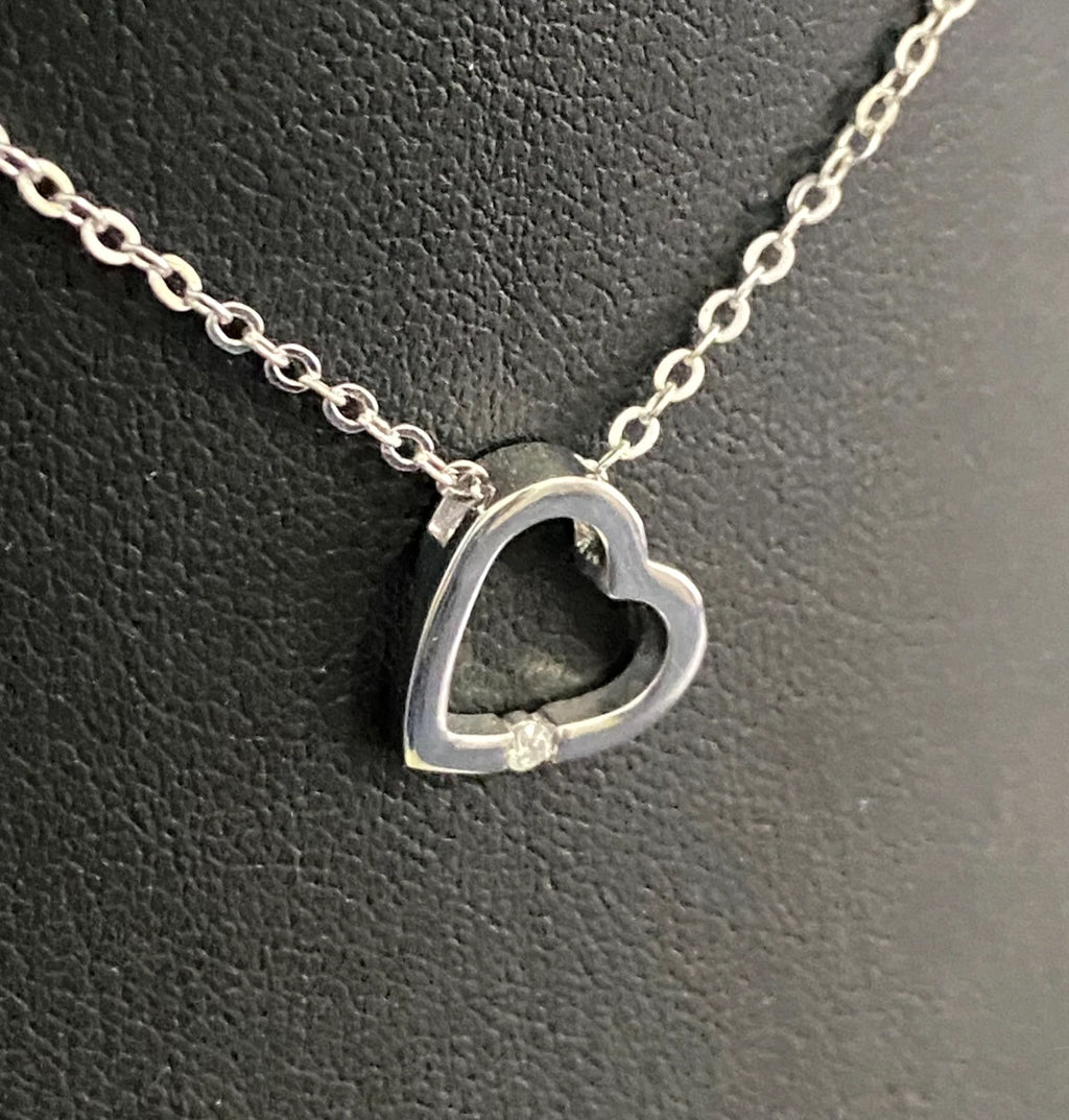 9K White Gold & Diamond Tension Set Heart Pendant