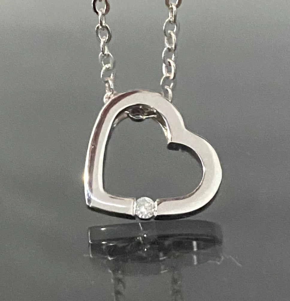 9K White Gold & Diamond Tension Set Heart Pendant